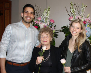 three smiling people