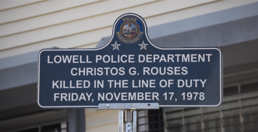 Lowell Police Department's sign in recognition of Christos Rouses.