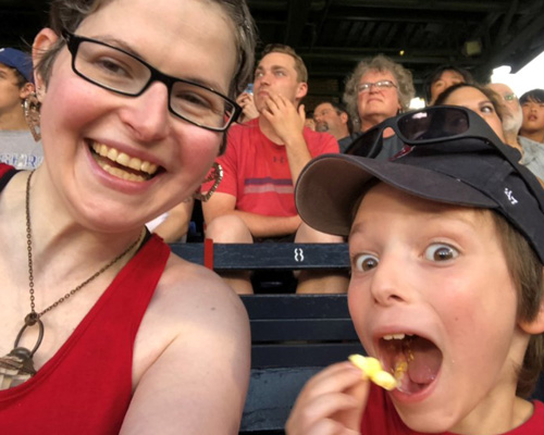 mom and son at a red sox game